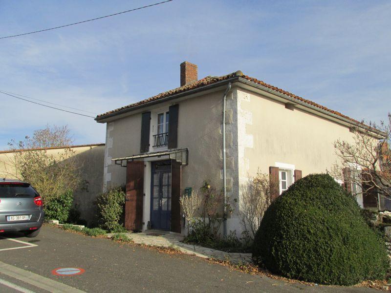 Maison en ville avec jardin