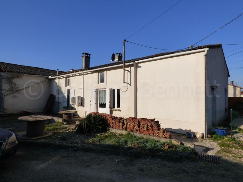 Part renovated stone house with outbuildings