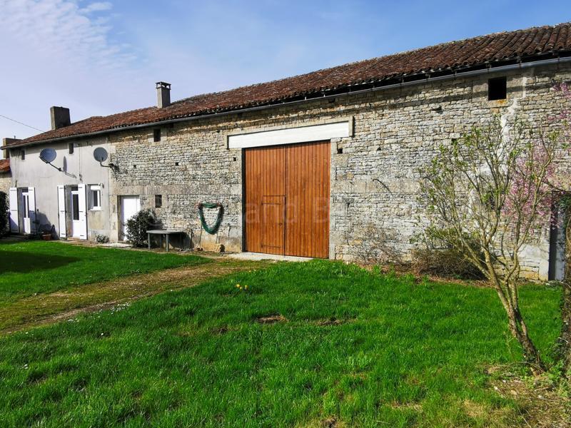 Traditional stone house with outbuildings + land