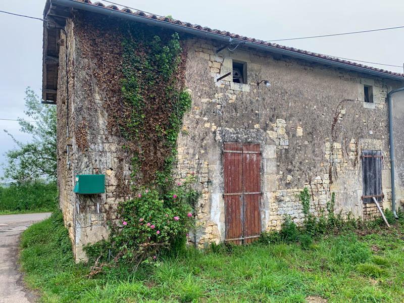 Stone house to renovate with outbuildings and land