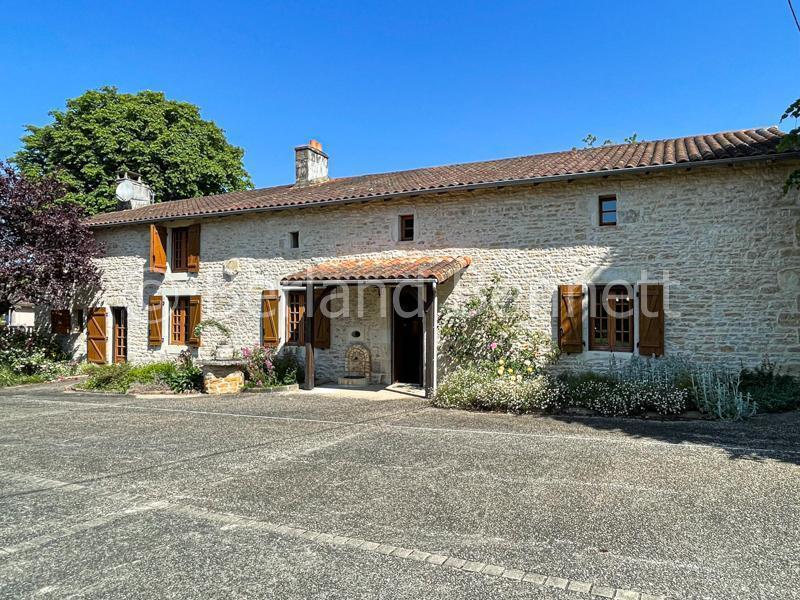 Gorgeous stone house with outbuildings + land