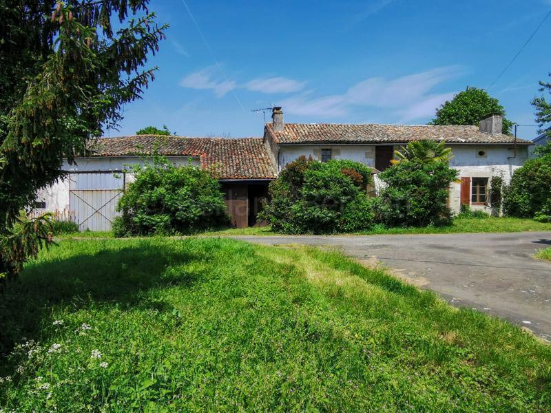 Stone cottage part renovated with outbuildings