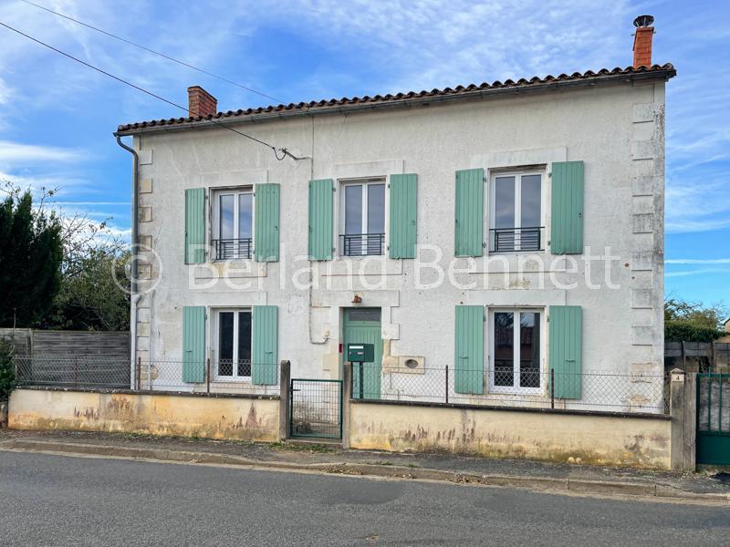 Detached stone village house with garden and outbuildings