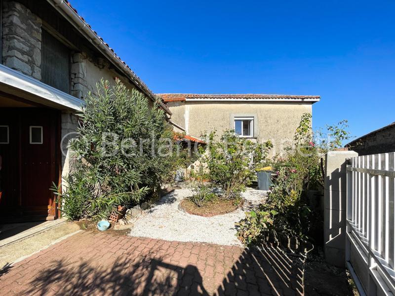 Stone house with pretty courtyard and outbuildings