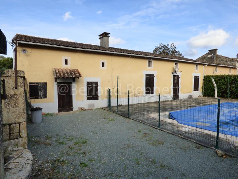 Large stone house with outbuildings and swimming pool