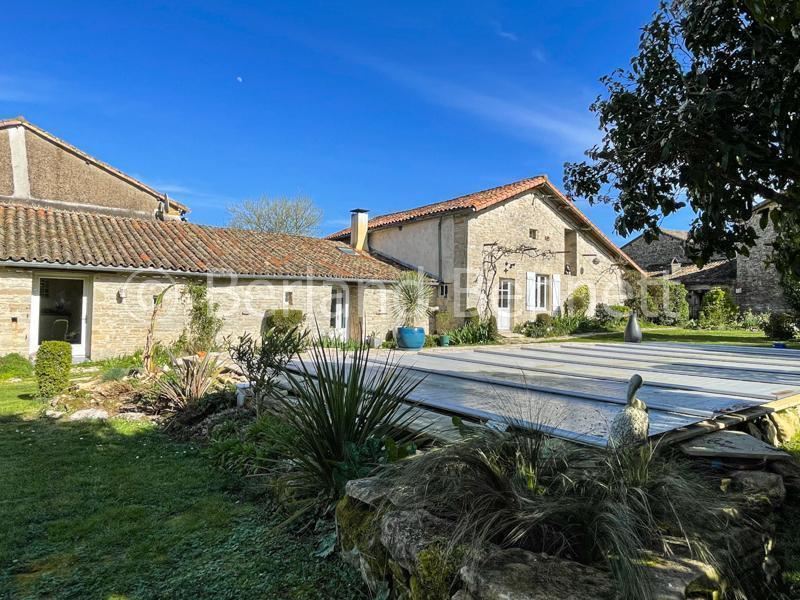 Character stone property with heated pool + pretty garden