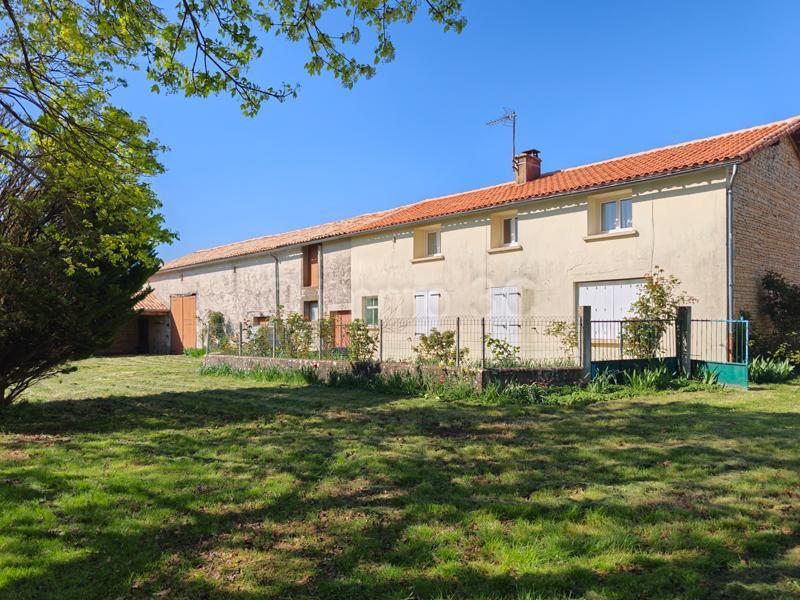 Stone farmhouse with outbuildings and land