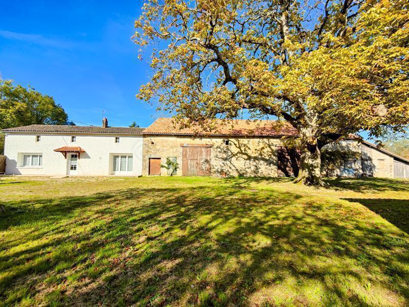 Detached south facing farmhouse with outbuildings and land