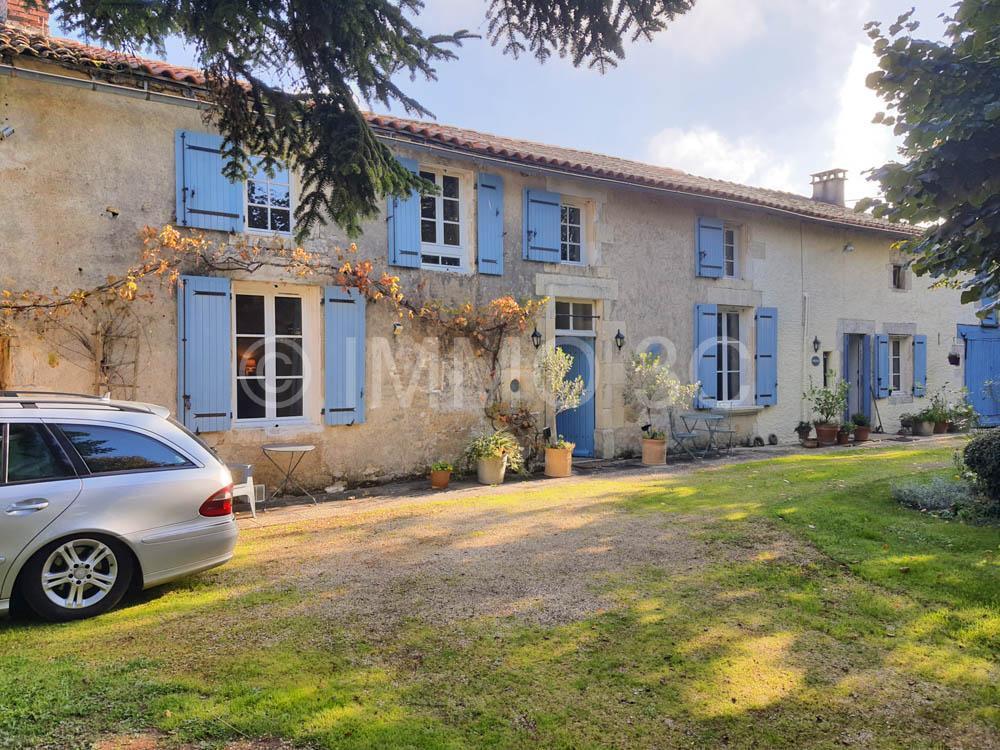 Pretty detached stone property with mature garden